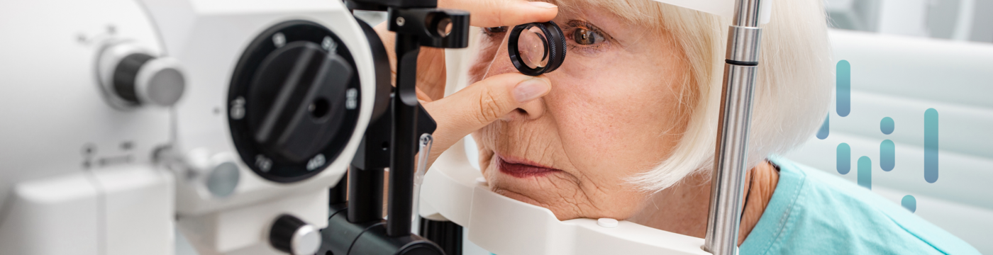 A patient's eye is being inspected using a magnifying glass